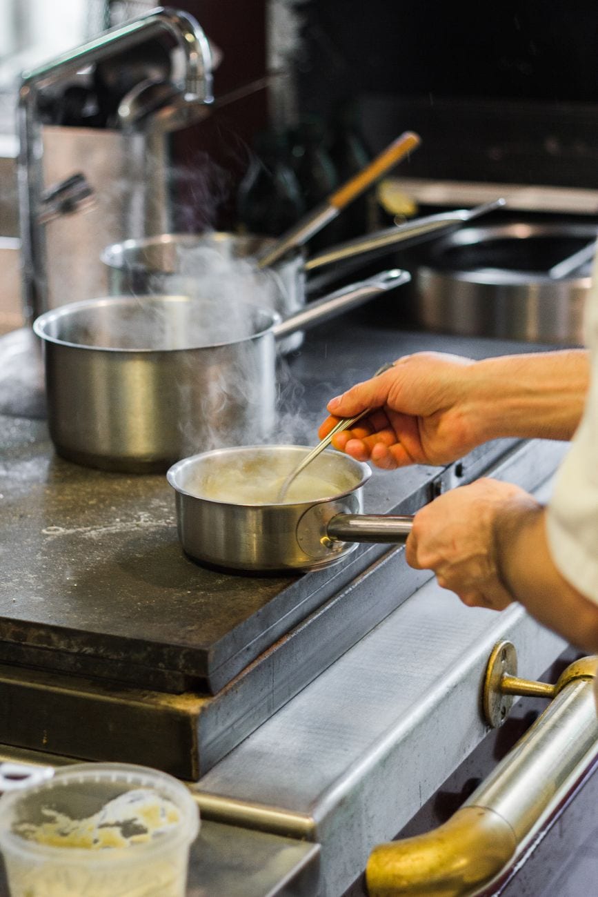 Professional chef plating a dish