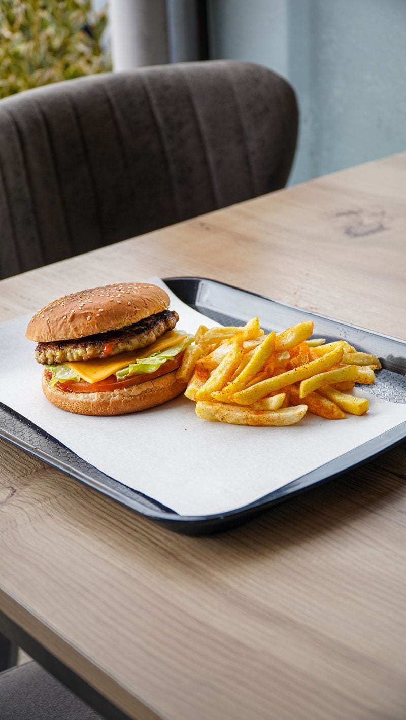 Freshly prepared signature burger with artisan sides