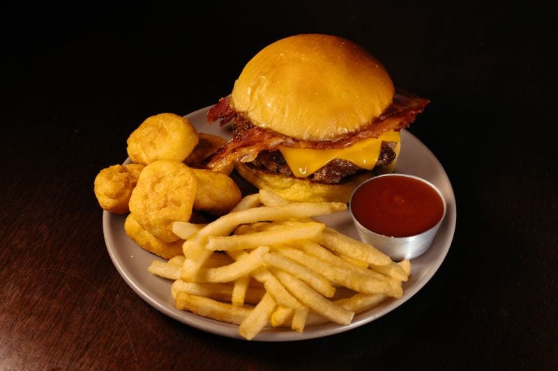 Gourmet burger with artisan brioche bun and craft sides